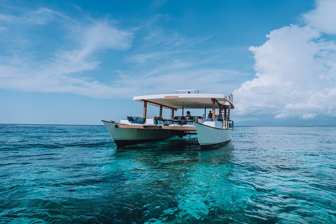 4-in-1 • Gili Islands Half-day Snorkel & Lunch Catamaran Tour - Included gear, towels, and the GoPro bonus