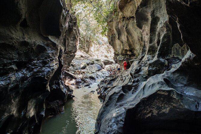 Bali Adventure Tour: Hidden Canyon, Tegenungan Waterfall, Goa Gajah temple - Pickup, air-conditioned minibus, and an 8.5-hour rhythm