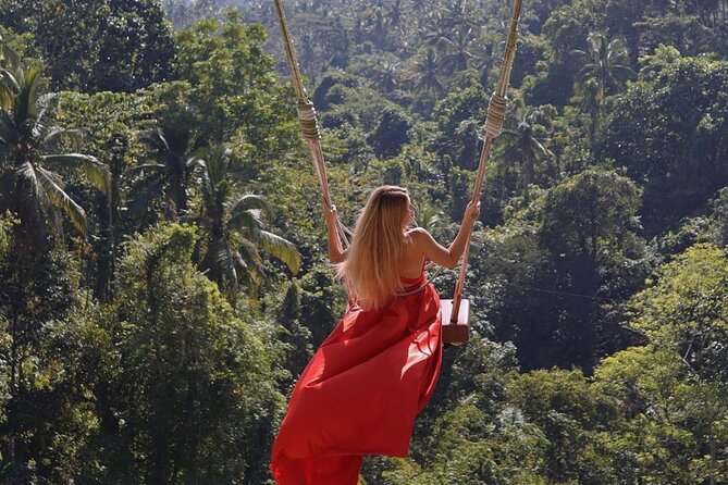 Bali Swing, Monkey Forest and Waterfall Private Tour - Kanto Lampo Waterfall near Gianyar: tiered rocks and a cool swim
