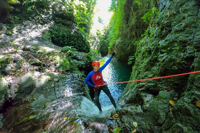 Canyoning Adventure in Sambangan Canyon - Inside the canyon: slides, jumps, abseils, swimming, and a single 20 m zip-line