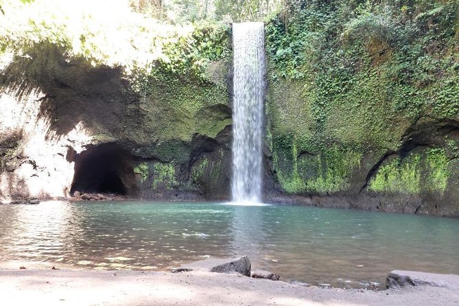 Get wet on Bali's most stunning waterfalls - Stop 1: Tukad Cepung Waterfall in the jungle corridor