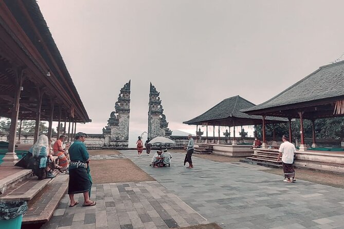 Lempuyang Gate of Heaven and City Tour - Tirta Gangga water gardens: fish ponds and a calmer hour
