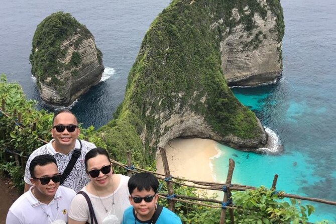 Private Nusa Penida West Trip - Kelingking Beach: the cliff view over hills and a strip of white sand